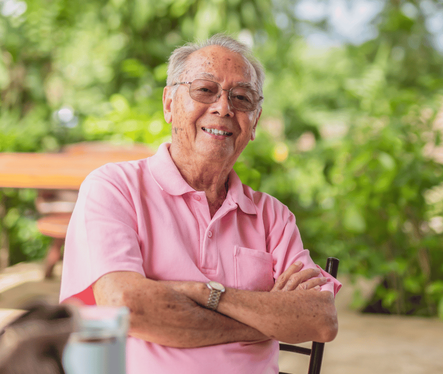 An older member relaxing in his garden