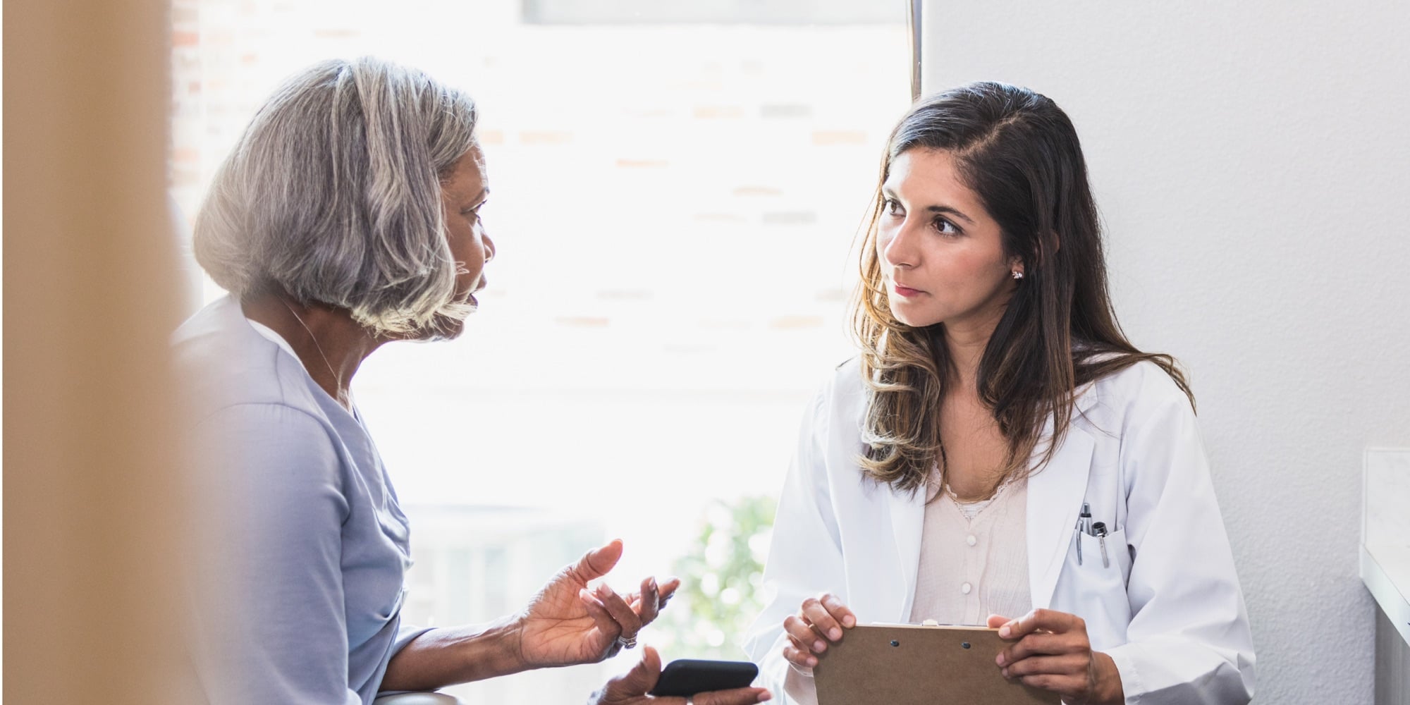 A primary care provider talking with a patient about her care plan