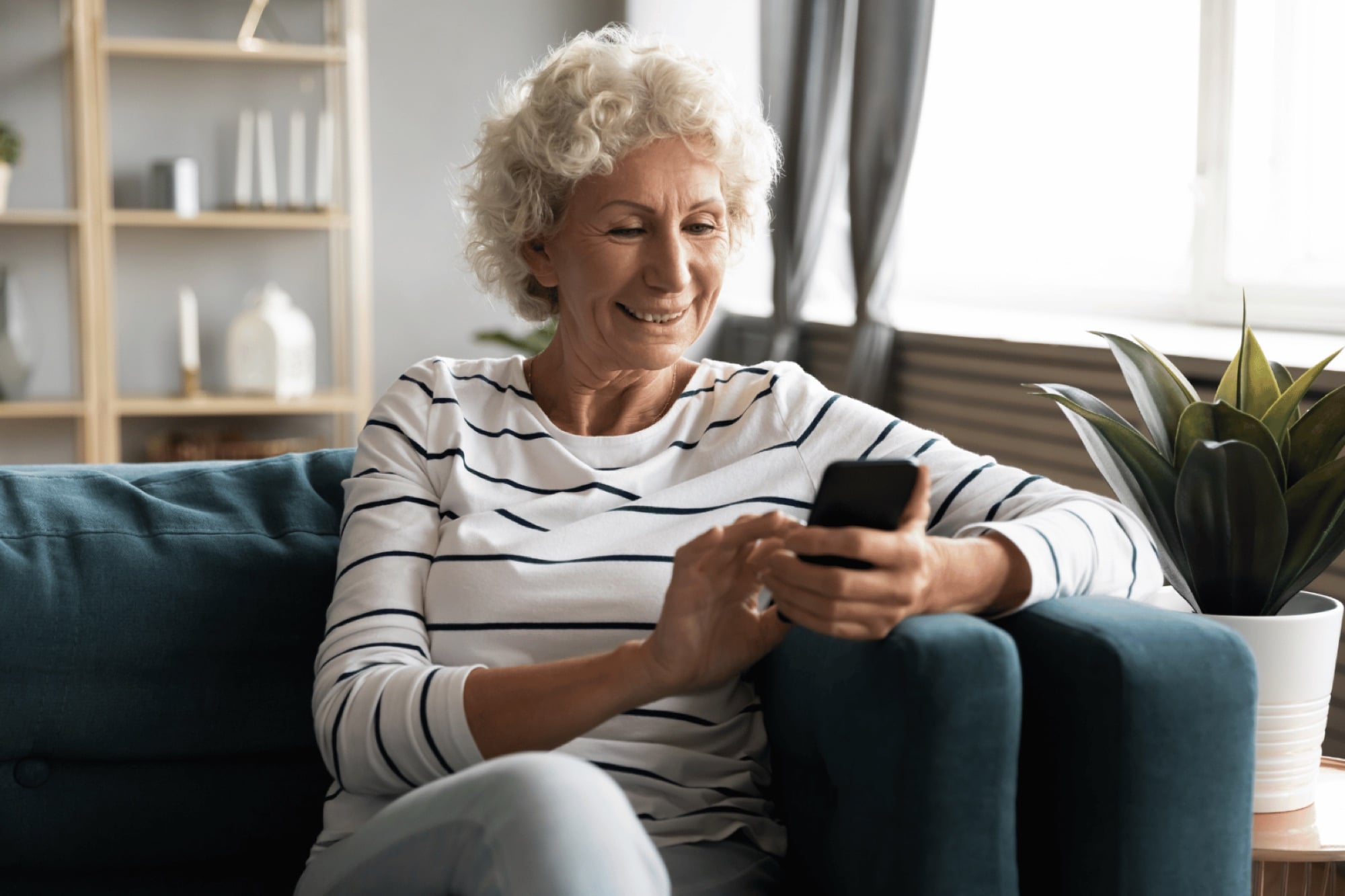 A member checking her care plan at home